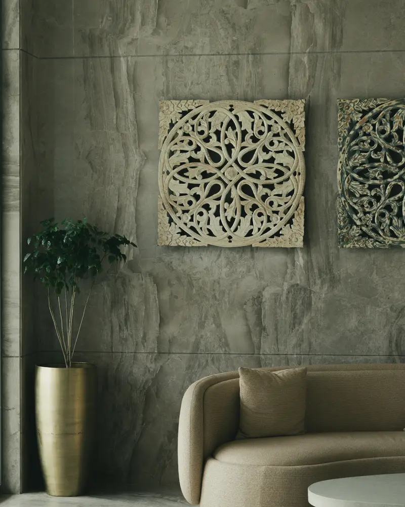 Grey concrete-effect plaster wall in a reception area with a curved sofa
